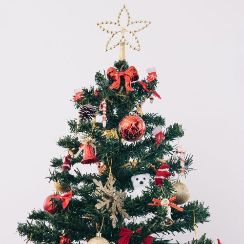 decorated-christmas-treefront-view-young-male-with-presents-and-christmas-tree-on-grey